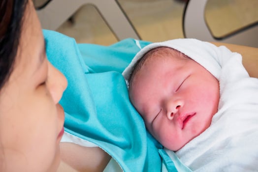 Happy Mother and Newborn Baby at the hospital photo