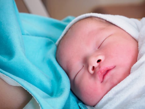 Happy Mother and Newborn Baby at the hospital photo