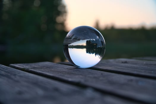 Glass ball on a wooden pier at a Swedish lake at evening hour. Nature Scandinavia photo