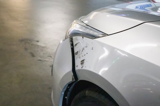car damaged on the front cause by car crash accident on the road photo