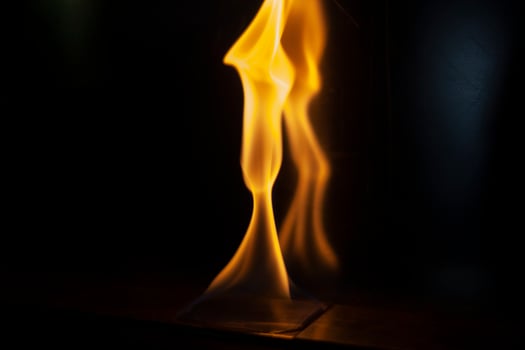 Fire in dark. Flame on black background. Alcohol burning. photo