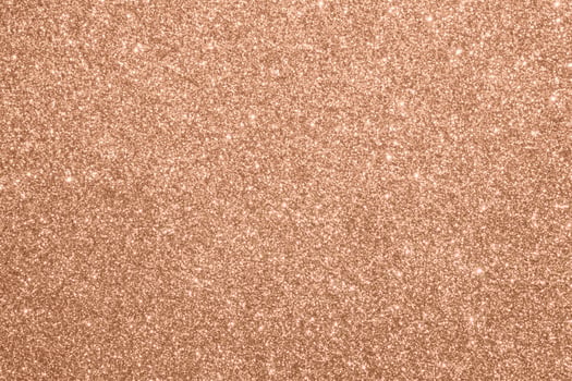 Abstract blur rose gold glitter sparkle defocused bokeh light background photo