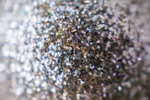Abstract blur silver glitter sparkle defocused bokeh light background photo