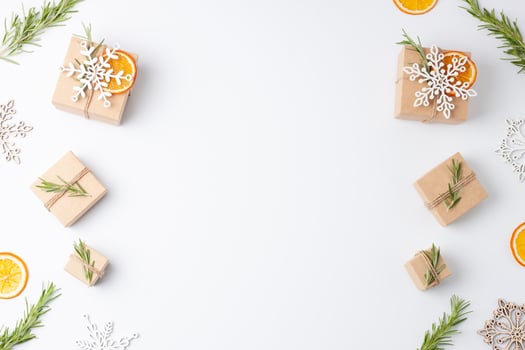 Eco friendly gifts in craft paper with rosemary on white background. Zero waste Christmas holiday concept. Flat lay, copy space photo