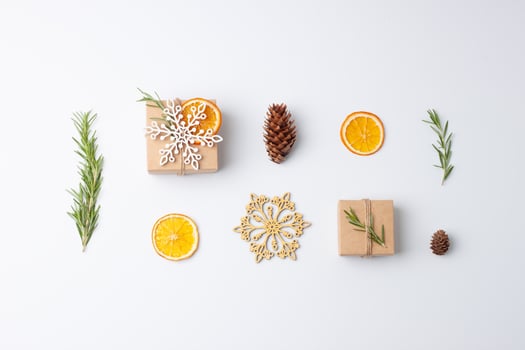 Christmas composition with eco friendly gifts in craft paper with rosemary on white background. Zero waste Christmas holiday concept. Flat lay, copy space photo