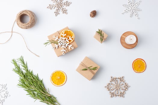 Christmas decorations with packaging gifts in craft paper on white background. Zero waste Christmas holiday concept. Flat lay, copy space photo