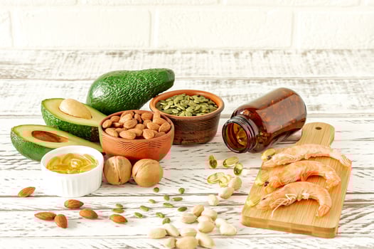 Animal and vegetable sources of omega-3 acids. Balanced diet concept. Assortment of healthy food on woodent table photo