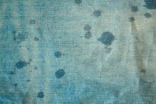 Background, texture, light blue denim and water drops. photo