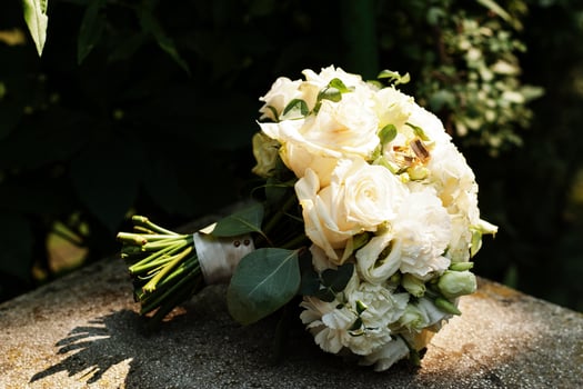 Beautiful tender wedding bouquet and rings. photo