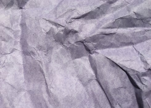 Abstract modern purple crumpled paper texture background. photo