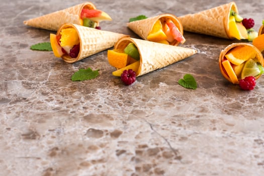 fruit waffle cones on a marble table. healthy eating. photo