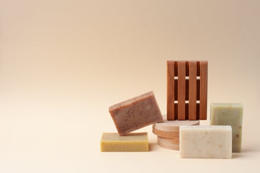 Soap on pastel beige background. Close up, copy space photo