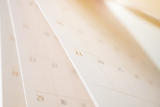 Calendar page flipping sheet close up blur background business schedule planning appointment meeting concept photo