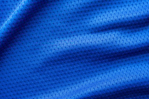 Blue color fabric sport clothing football jersey with air mesh texture background photo