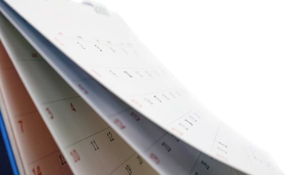 White paper desk calendar isolated on white background photo