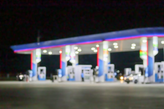 Petrol gas station at night time blurred background with bokeh light photo