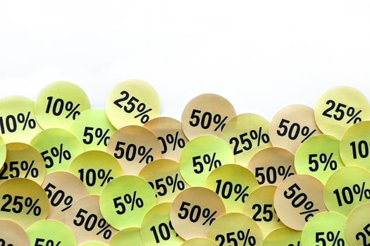 Large amount of stickers with yellow percentage values for black friday or cyber monday sale. Abstract image of discount prices photo