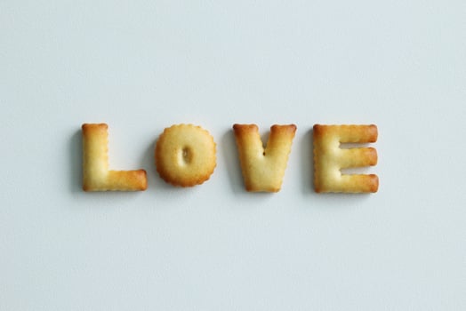 An inscription from the cookies on the white background. Text - love. photo