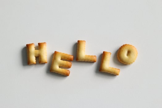 An inscription from the cookies on the white background. Text - Hello. photo