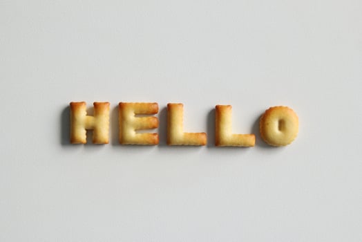 An inscription from the cookies on the white background. Text - Hello. photo
