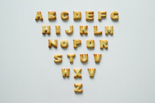 An English alphabet from the cookies on the white background. photo