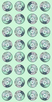 Many used spray cans for graffiti drawing lies on a pastel colored backgroung. Street art painting concept. Minimal flat lay pattern. Top view photo