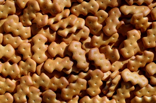 Pattern of a many yellow salted crackers photo
