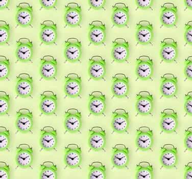 Wasting time concept. Many green alarm clock photo