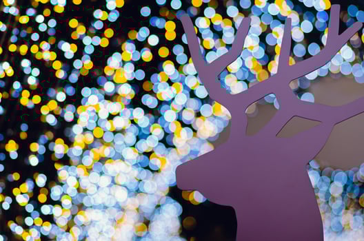 Pink wooden Reindeer decorates for Christmas Holiday with colorful bokeh lights. photo