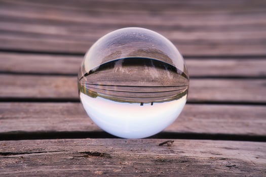 Glass ball on a wooden pier at a Swedish lake at evening hour. Nature Scandinavia photo