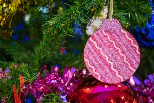 Decorated Christmas baubles on fir tree New Year holidays background photo