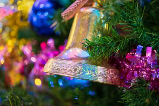 Decorated Christmas bell baubles on fir tree New Year holidays background photo