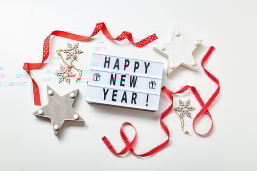 Light box inscription Happy New Year and wooden decorations photo