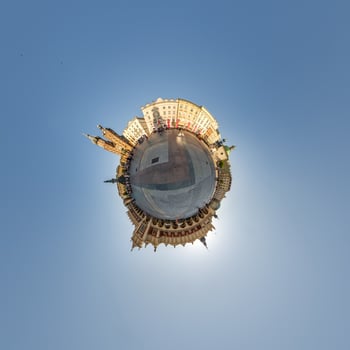 Little planet and spherical aerial 360 panorama view on street ancient medieval city with church and historic buildings photo