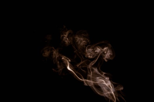 white smoke on a black background photo