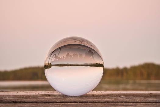 Glass ball on a wooden pier at a Swedish lake at evening hour. Nature Scandinavia photo