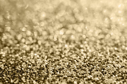 Abstract gold glitter sparkle blurred with bokeh background photo