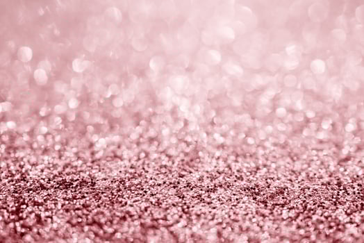 Abstract rose gold glitter sparkle texture with bokeh background photo