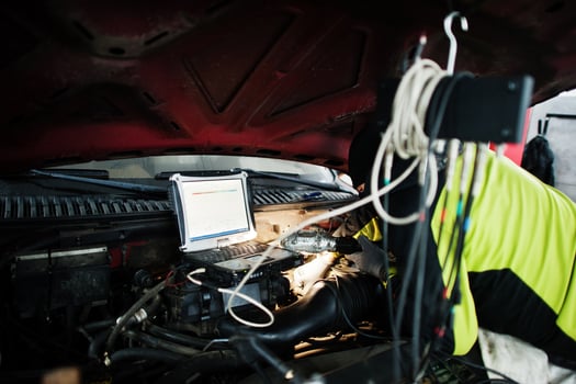 Auto mechanic sets american SUV car for diagnostics and configuration in workshop service station.. photo
