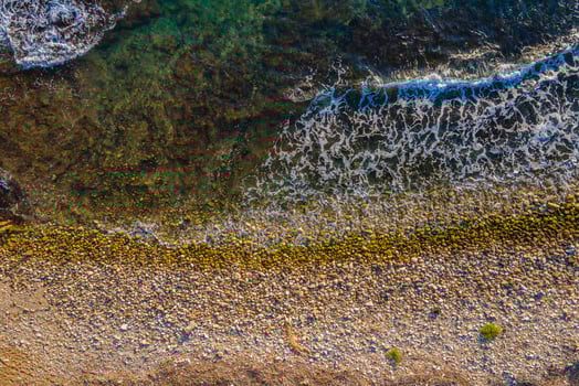 Overhead shot of beach waves coming towards the shore photo