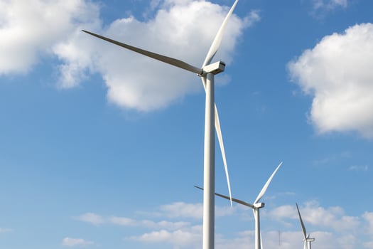 Wind turbine generate electricity with blue sky at Khao Kho Thailand. photo