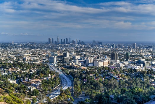 Downtown Los Angeles skyline over blue cloudy sky in California from Hollywood Hills. photo