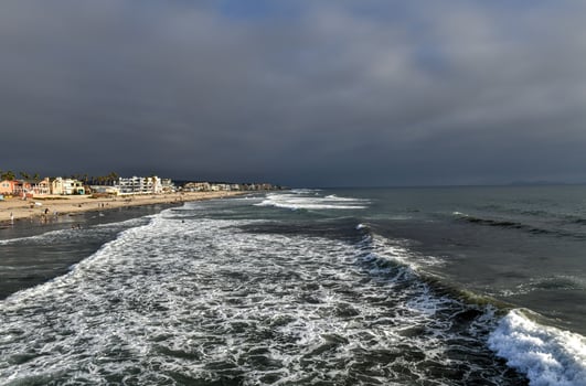 The pier and Pacific Ocean at sunset, in Imperial Beach, near San Diego, California photo