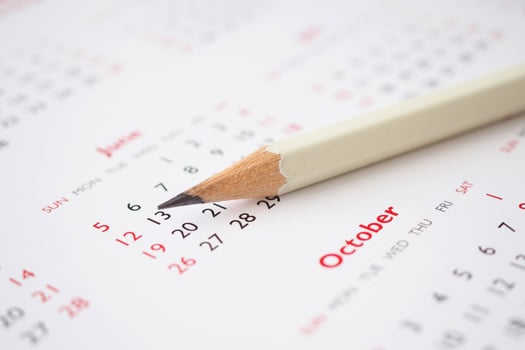 white pencil on calendar background business planning appointment meeting concept photo