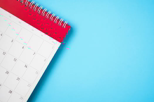 calendar page on blue background business planning appointment meeting concept photo