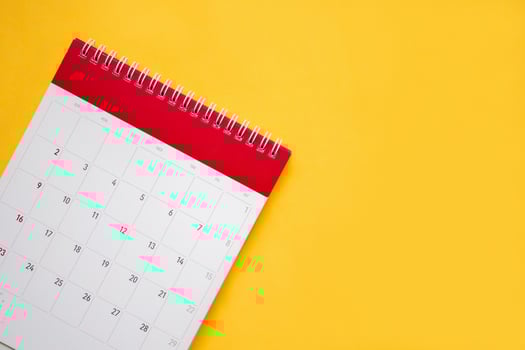 calendar page on yellow background business planning appointment meeting concept photo