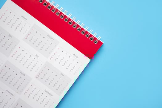 calendar page on blue background business planning appointment meeting concept photo