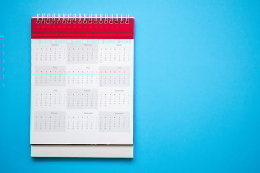calendar page on blue background business planning appointment meeting concept photo