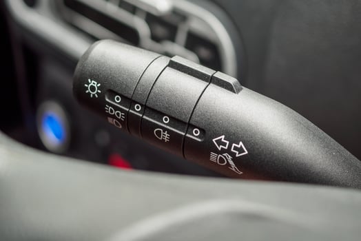 Car light control switch close up photo