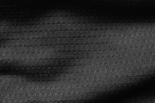 Black sport cloth fabric football shirt jersey texture close up photo